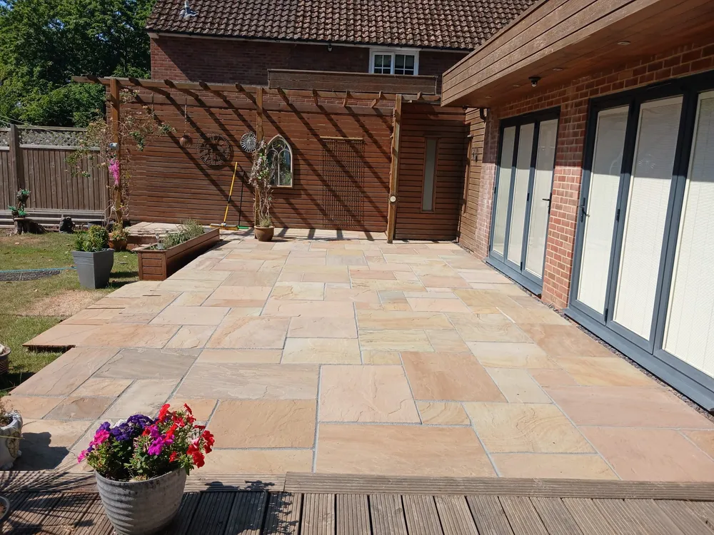 Same natural stone patio fully restored after professional jet washing